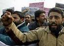 _kashmiris_org_PhotosHome_photos-2005_Kashmiri_activists_of_the_People_27s_Freedom_League_(PFL)_party_shout_slogans_against_Indian_security_forces_during_a_protest_in_Srinagar_2C_December_17_2C_2004.jpg