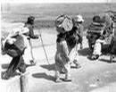 _dwightdeisenhower_com_koreanwar_Refugees_boy_pushing_cart.jpg